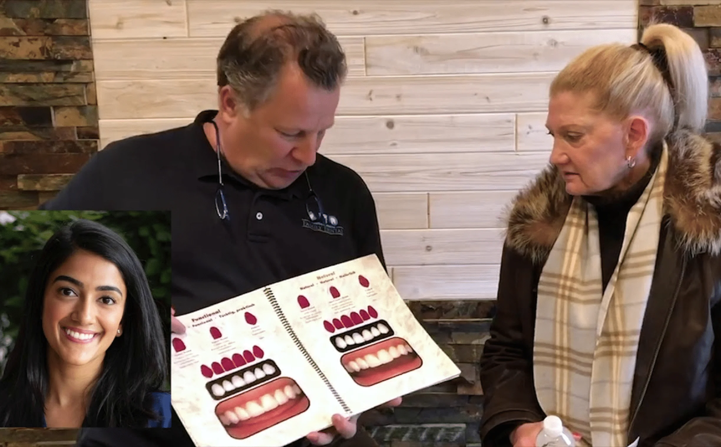 Dr. Al Internoscia talking veneers with Adrienne, holding a shade guide